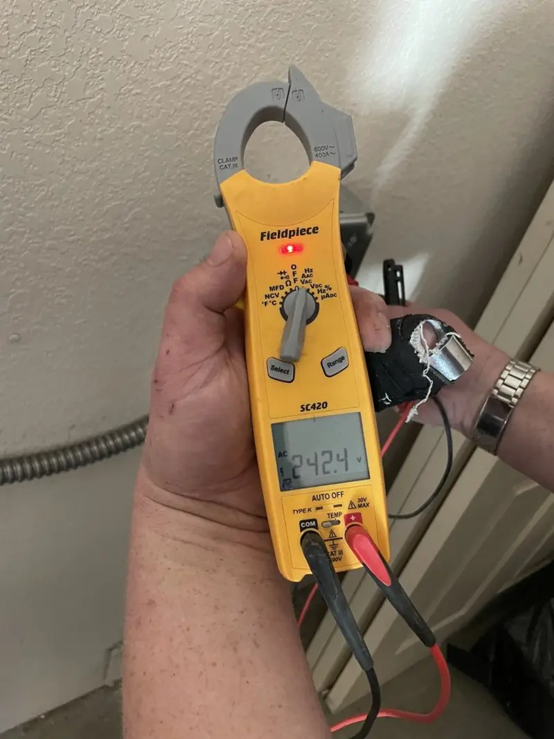 Voltage testing with clamp meter during Whole House Surge Protector in Rupert